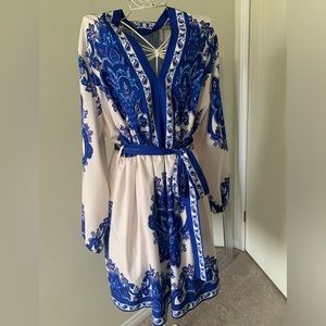 Silky dress.  V-neck, elastic waist with tie belt. Never worn.